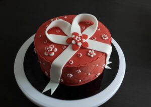 Cadeau rouge et ruban blanc